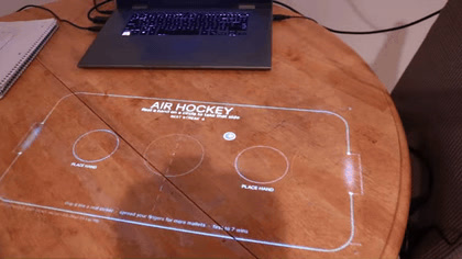 Projected air hockey on a table